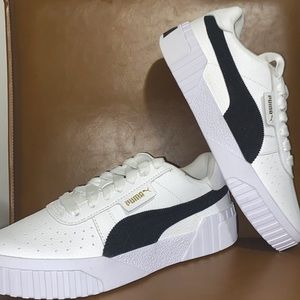 White Pumas. Size womens 7.5. Never been worn.